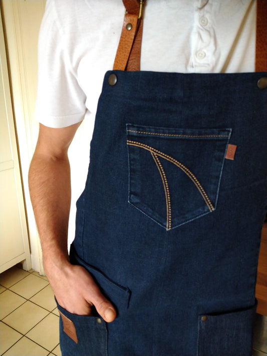 Cooking apron/barbecue apron made of dark blue denim with removable leather straps